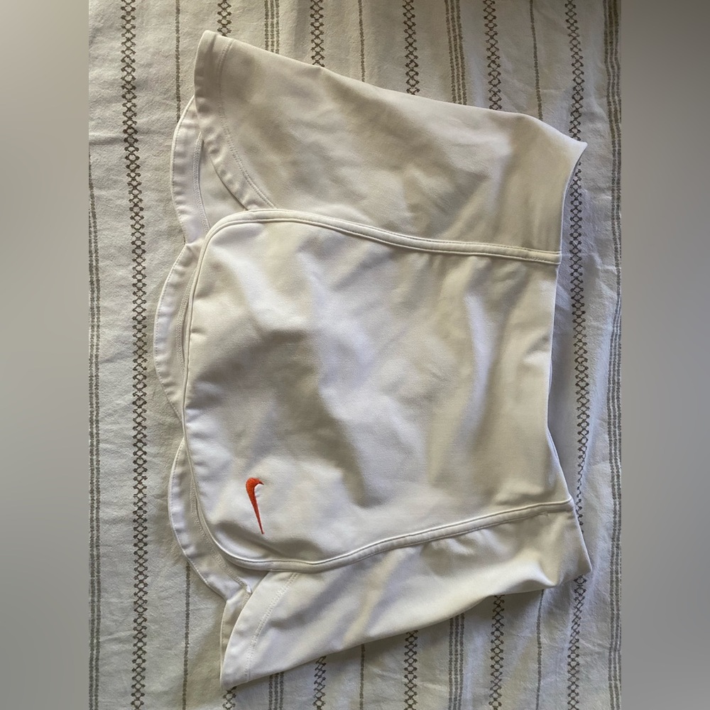 Tennis skirt with attached spandex shorts. Tulip hem design.